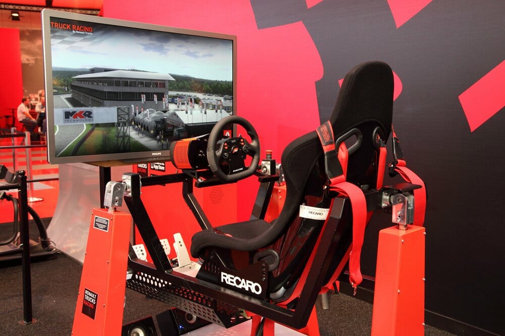 Sim racing accessories including steering wheel, pedals, and seat